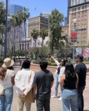 Guests standing in Pershing Square on the Downtown LA walking tour