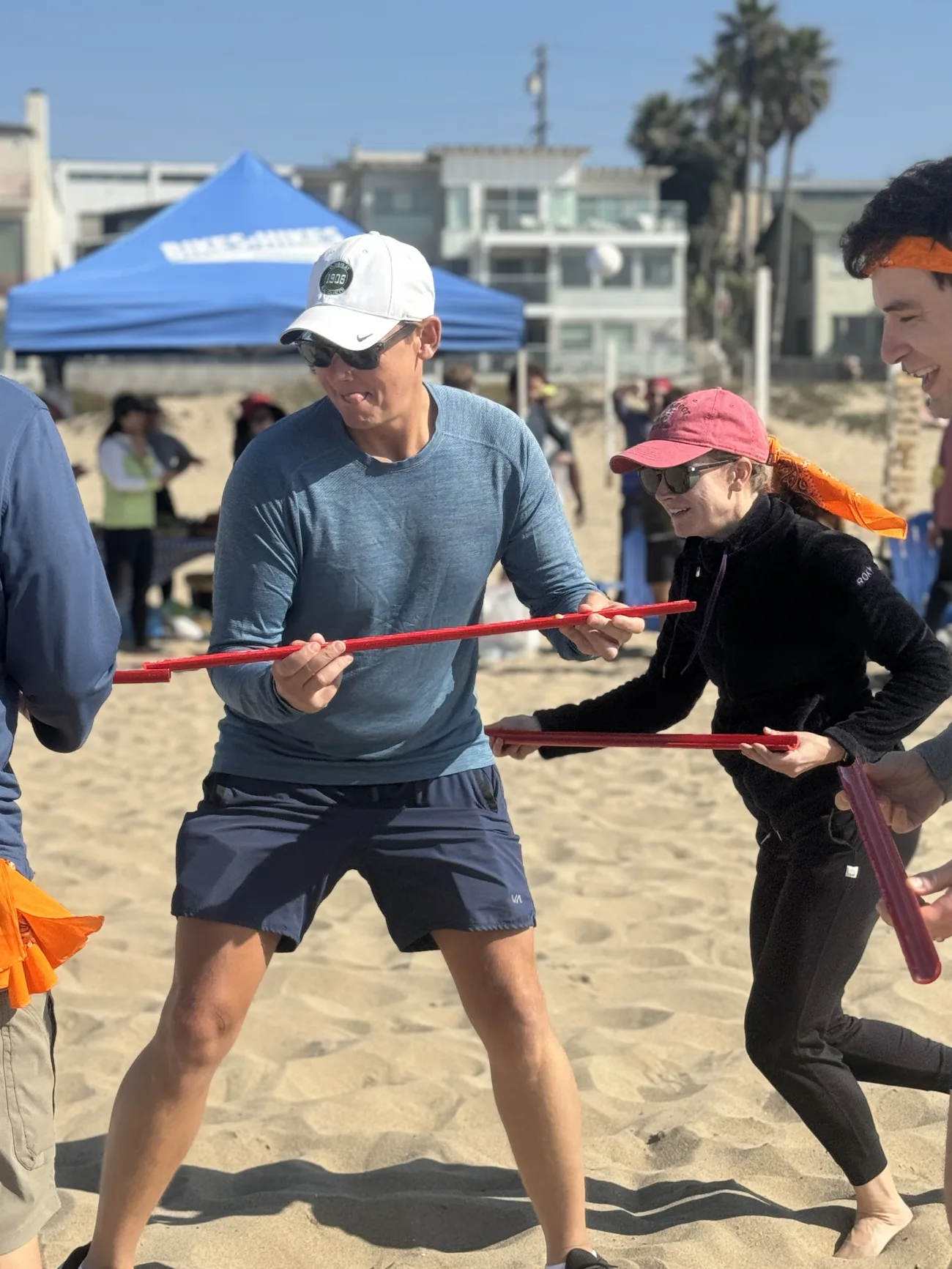 A team hustles on the beach