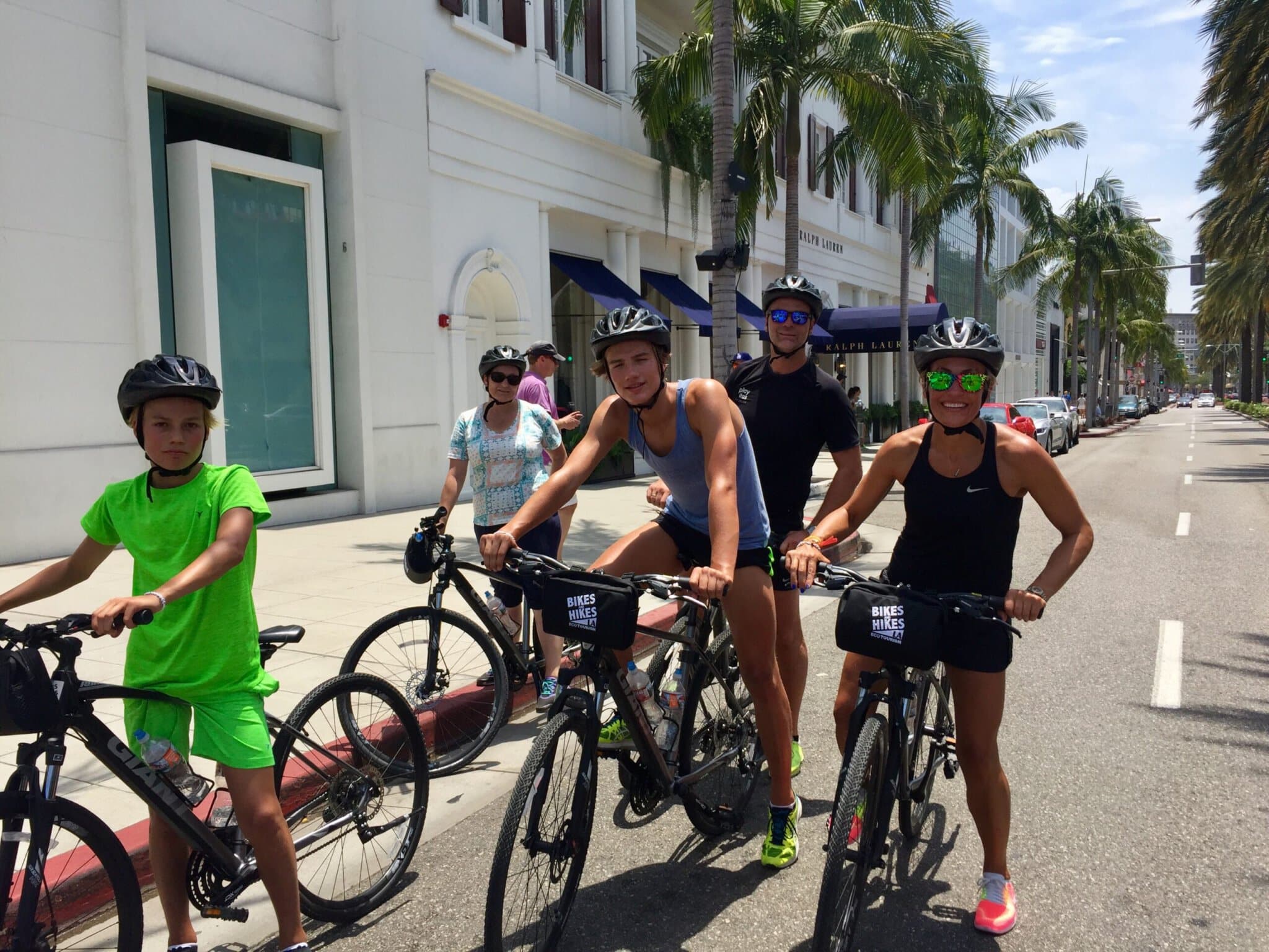Guests on the Beverly Hills Bike Tour on Rodeo Dr.