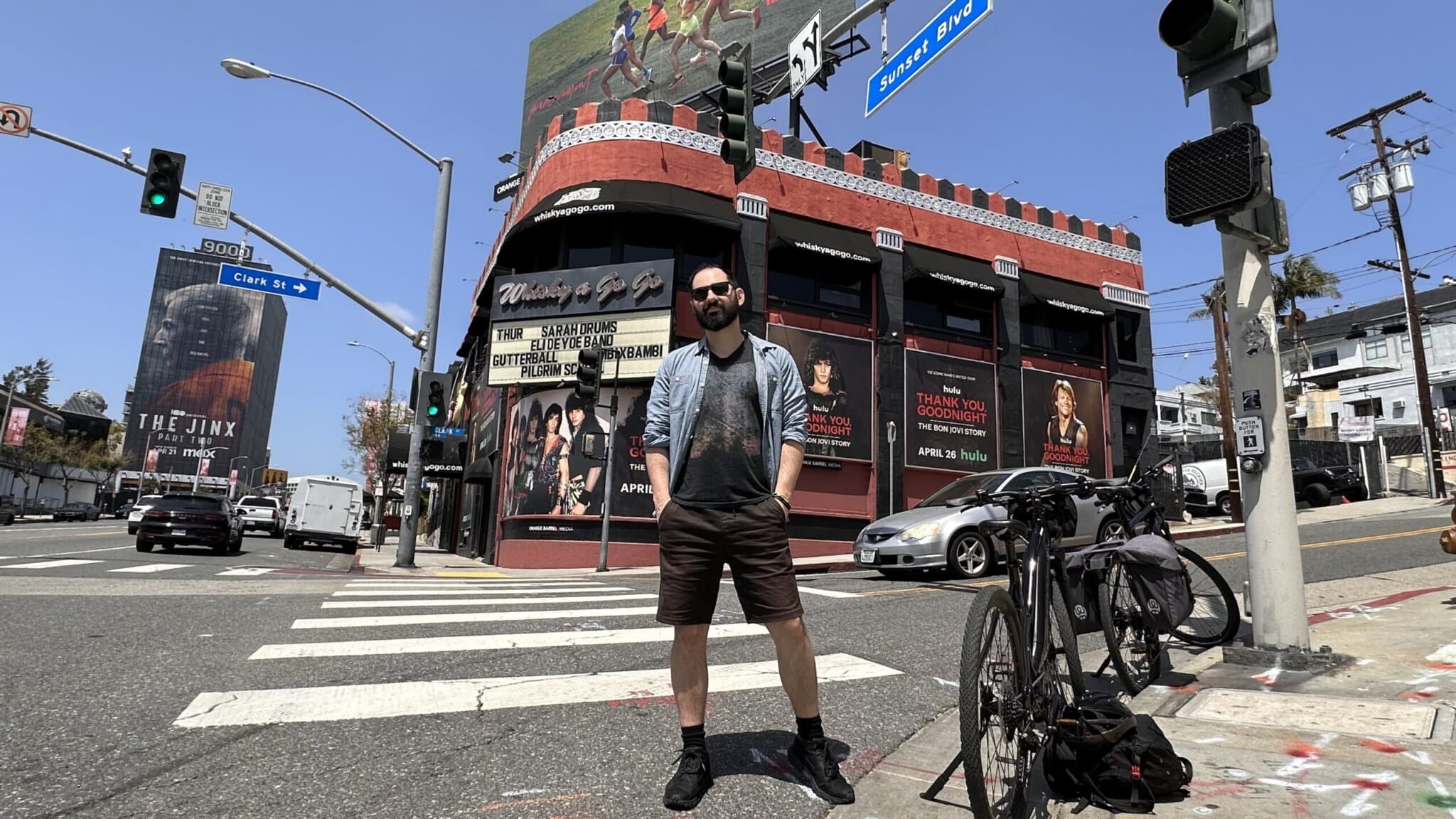 Man standing on sunset boulevard in front of concert venue