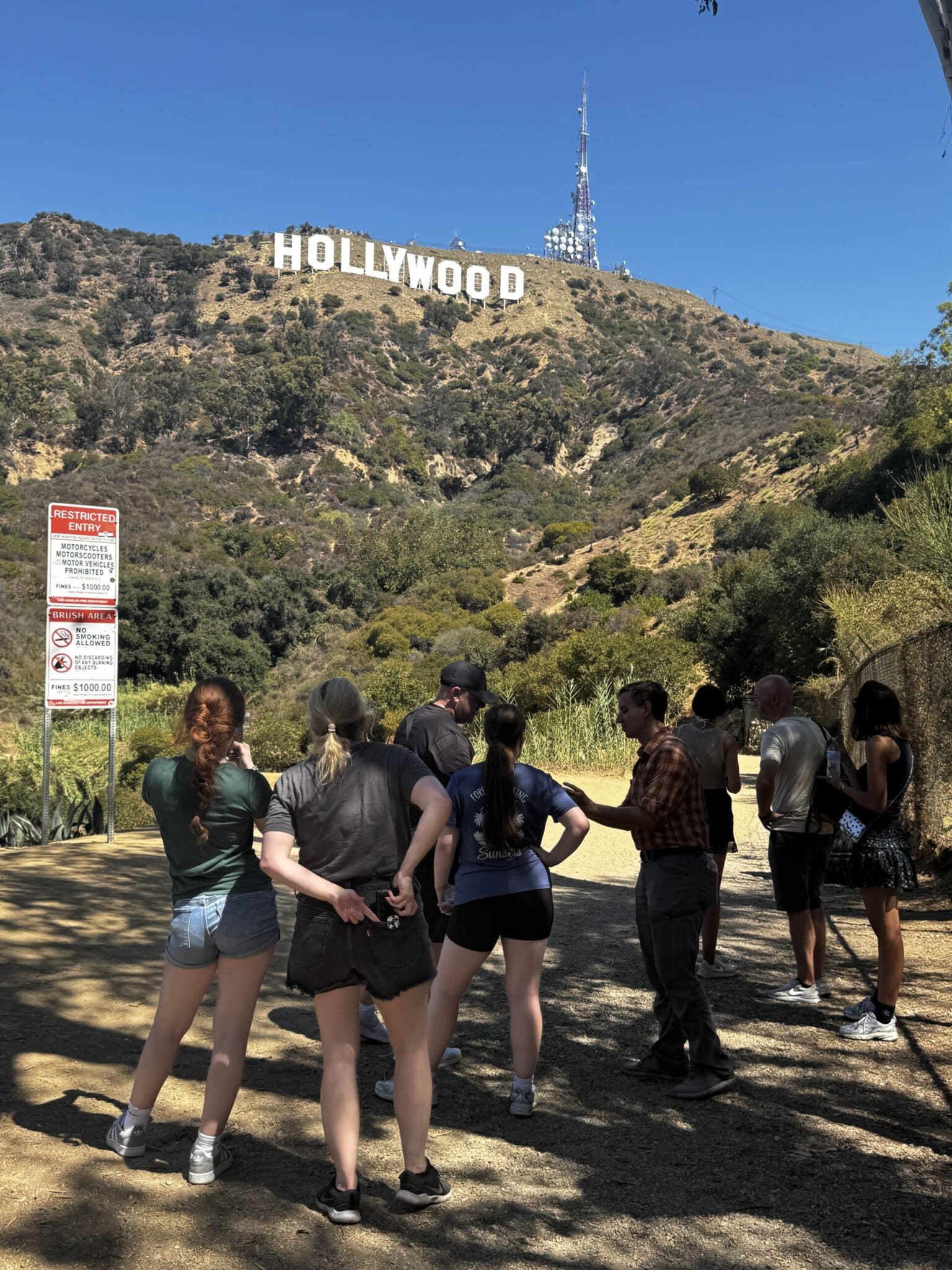 Guests with the Hollywood Sign on the Hollywood Sign E-Bike Tour