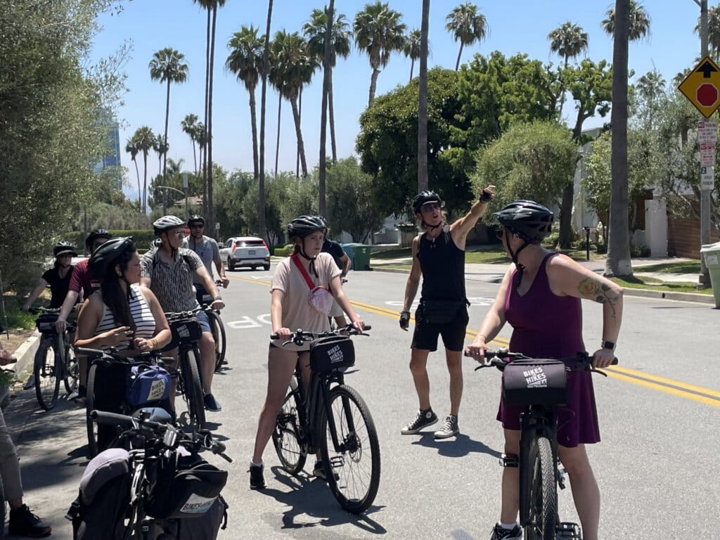 the Tour guide gives the group information as they stop to sightsee on the Beverly Hills Tour