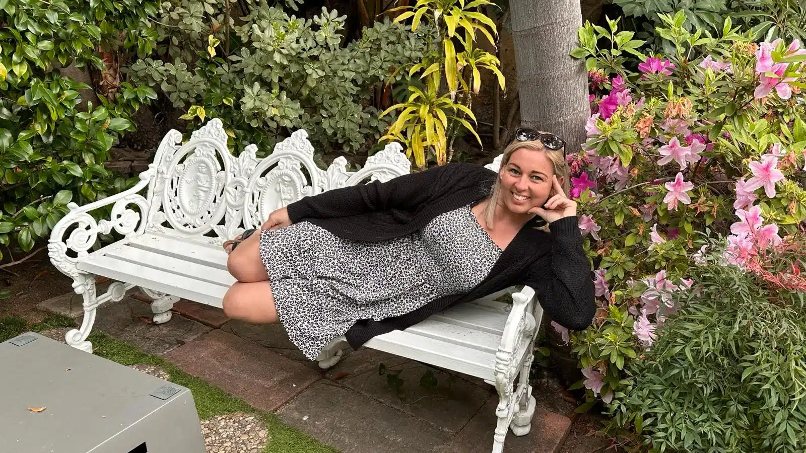 A guest lays on a bench on the sunset strip on the west hollywood bike tour