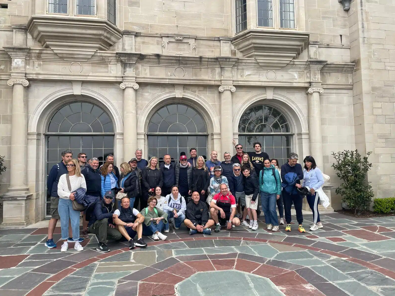 Guests pose at Greystone Mansion on a corporate Beverly hills tour