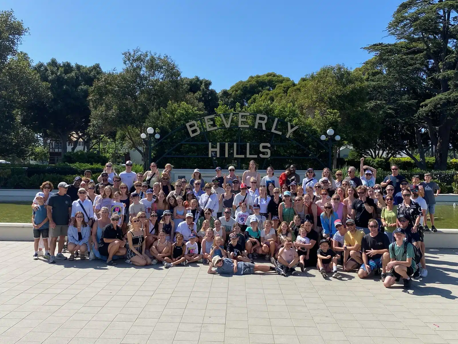 Guest in front of the Beverly Hills Sign