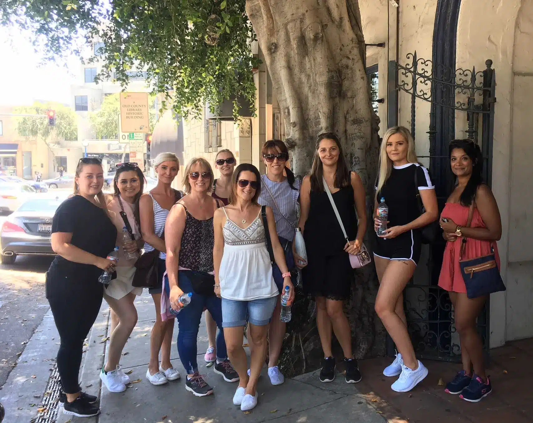 Guests pose on a West Hollywood street on a West Hollywood Bike Tour