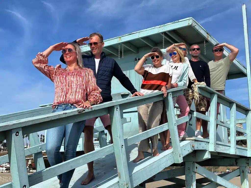 Guest on a lifeguard tower on the Santa Monica and Venice Beach Bike Tour