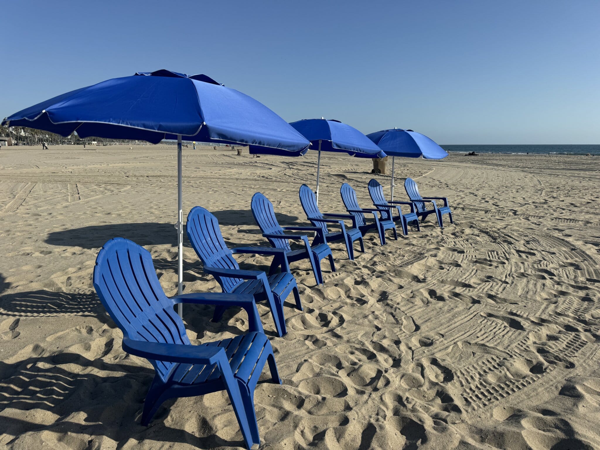 Chairs and umbrellas on the beach for a surfing lesson