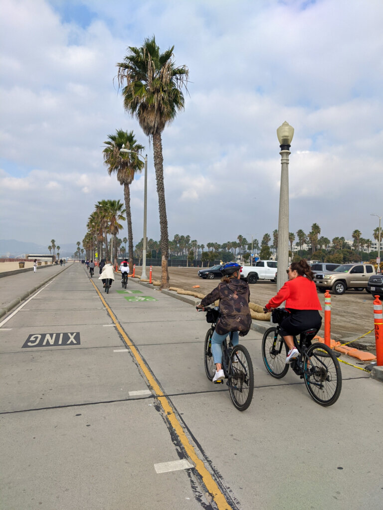 Guests riding along the boardwalk in Santa Monica