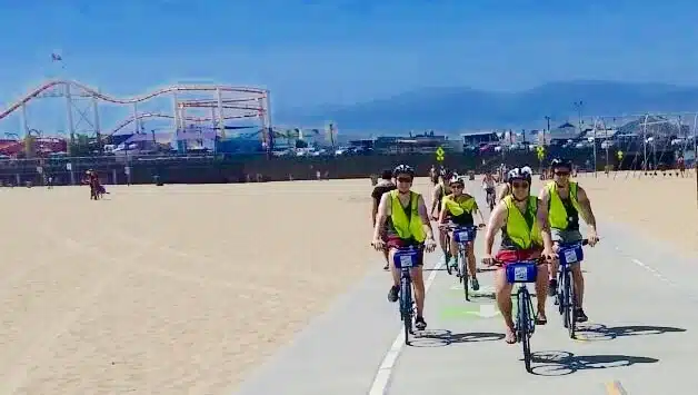 Guests riding near the Santa Monica Pier on the Santa Monica Bike Tour