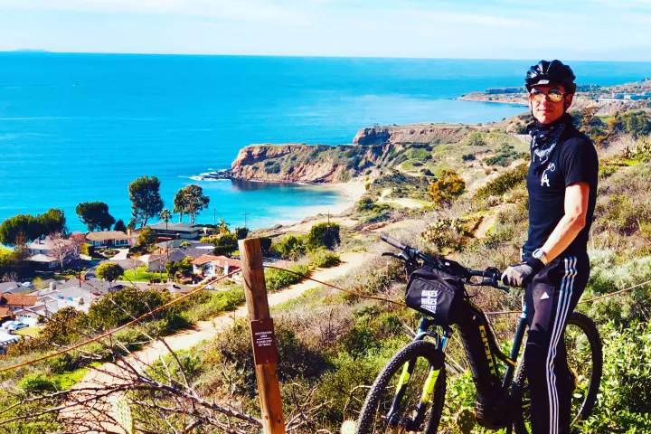 A guest looks over the ocean on a terranea bike ride