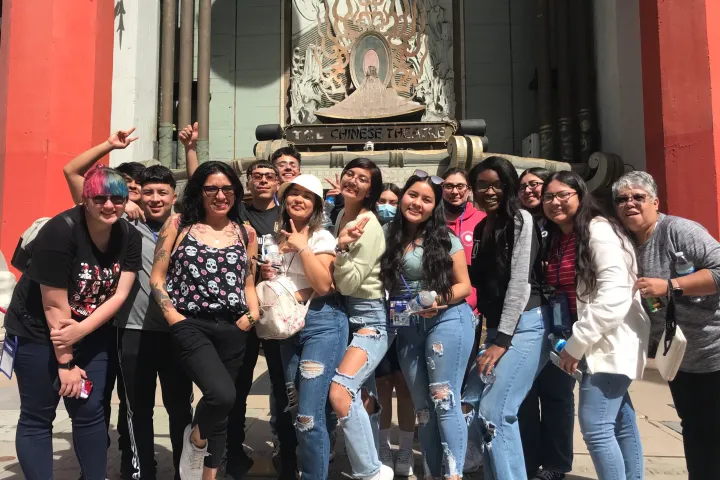 A student travel group poses on the Hollywood Walk of Fame Tour