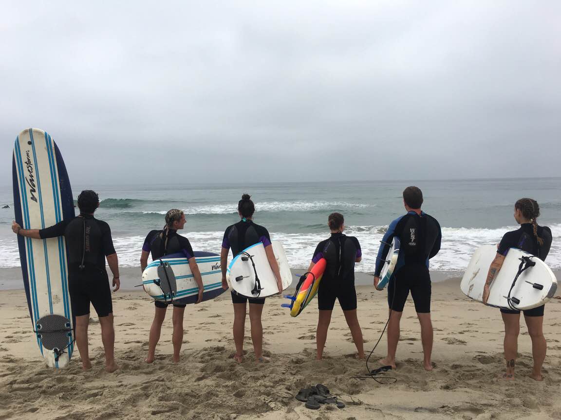 Getting ready to enter the water during a surf lesson