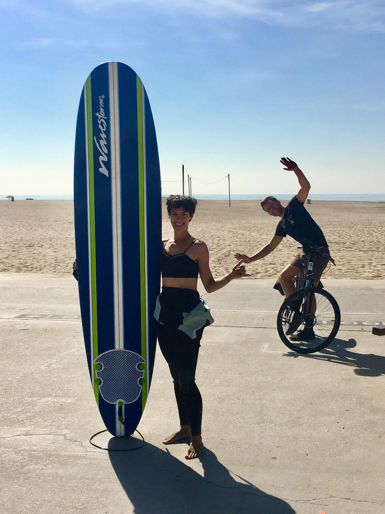 Guests posing and having fun during a group surfing lesson