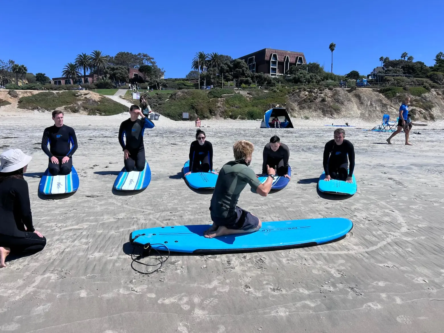 Instruction during a group surf lesson