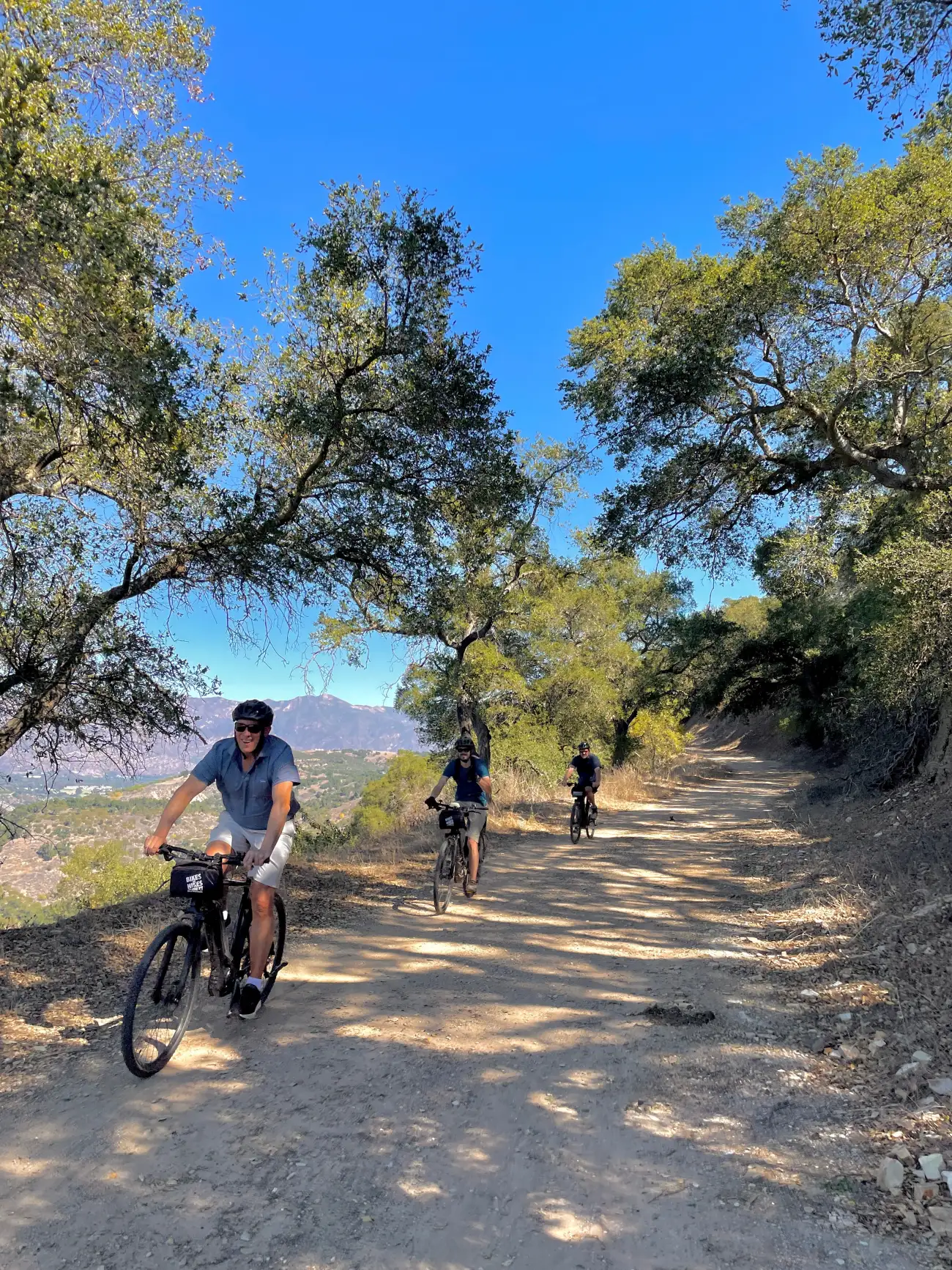 guests riding on bikes on a dirt trail on the terranea fitness bike tour