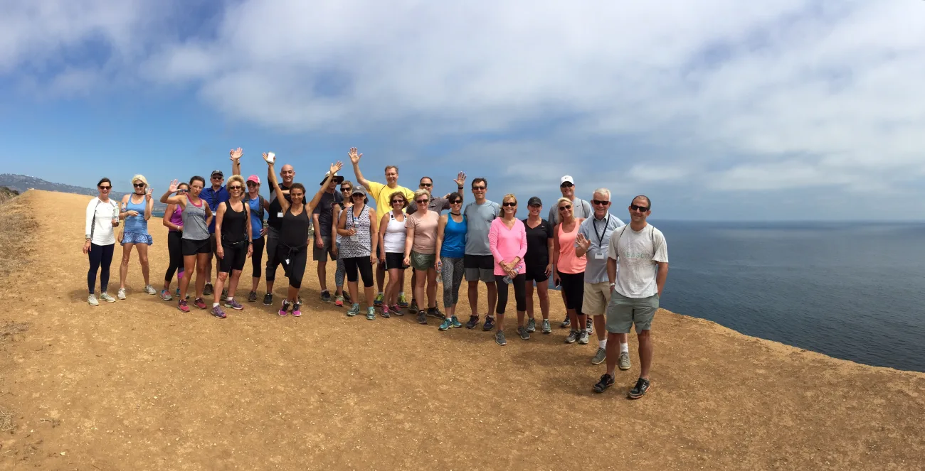 Group gathered on a coastal bluff during a guided Palos Verdes nature walk with ocean views