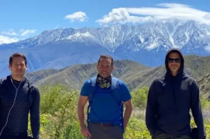 Guests stand looking at a mountain in the Ojai Valley
