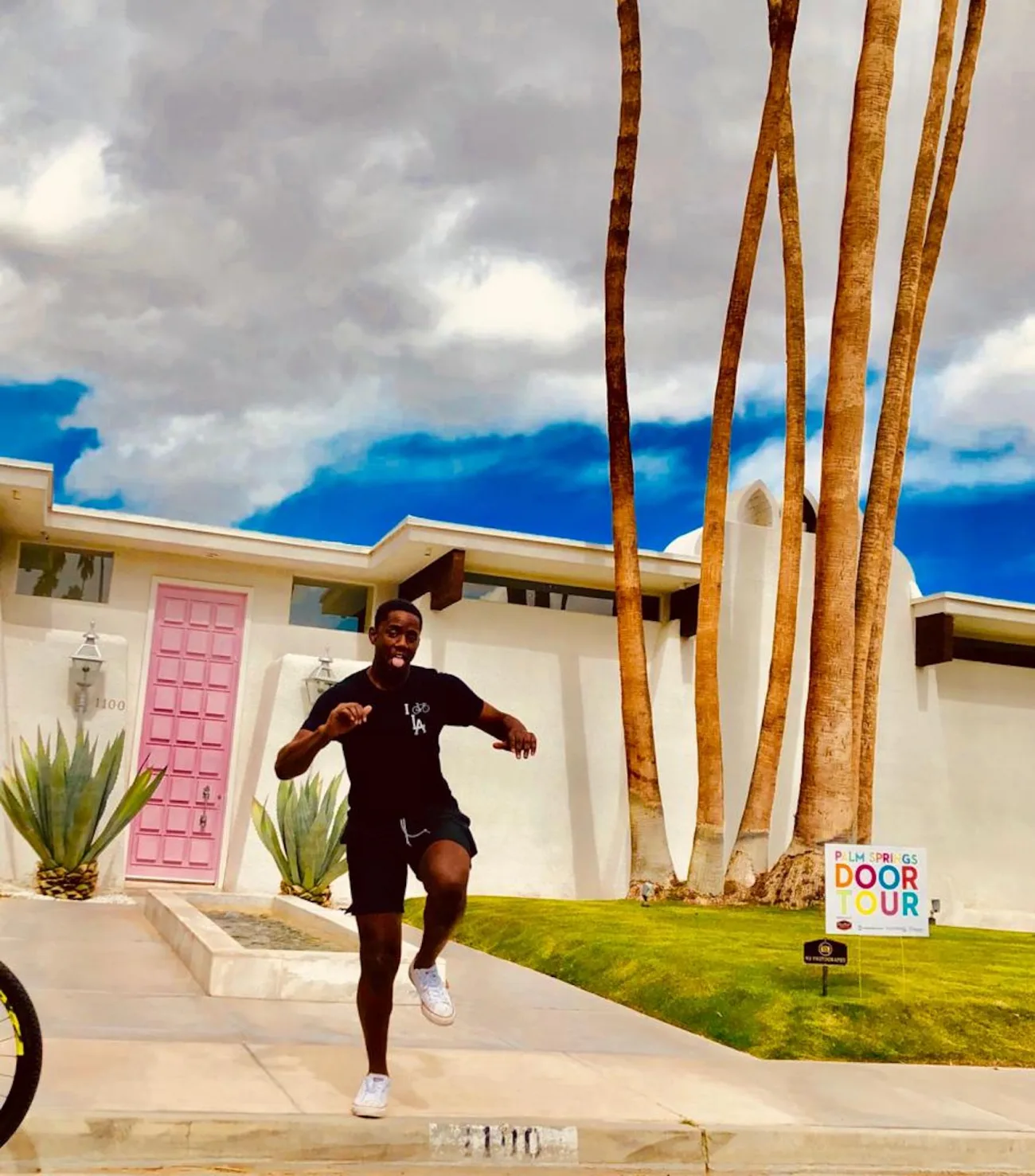 Guest in front of a home on a palm springs architectural walking tour
