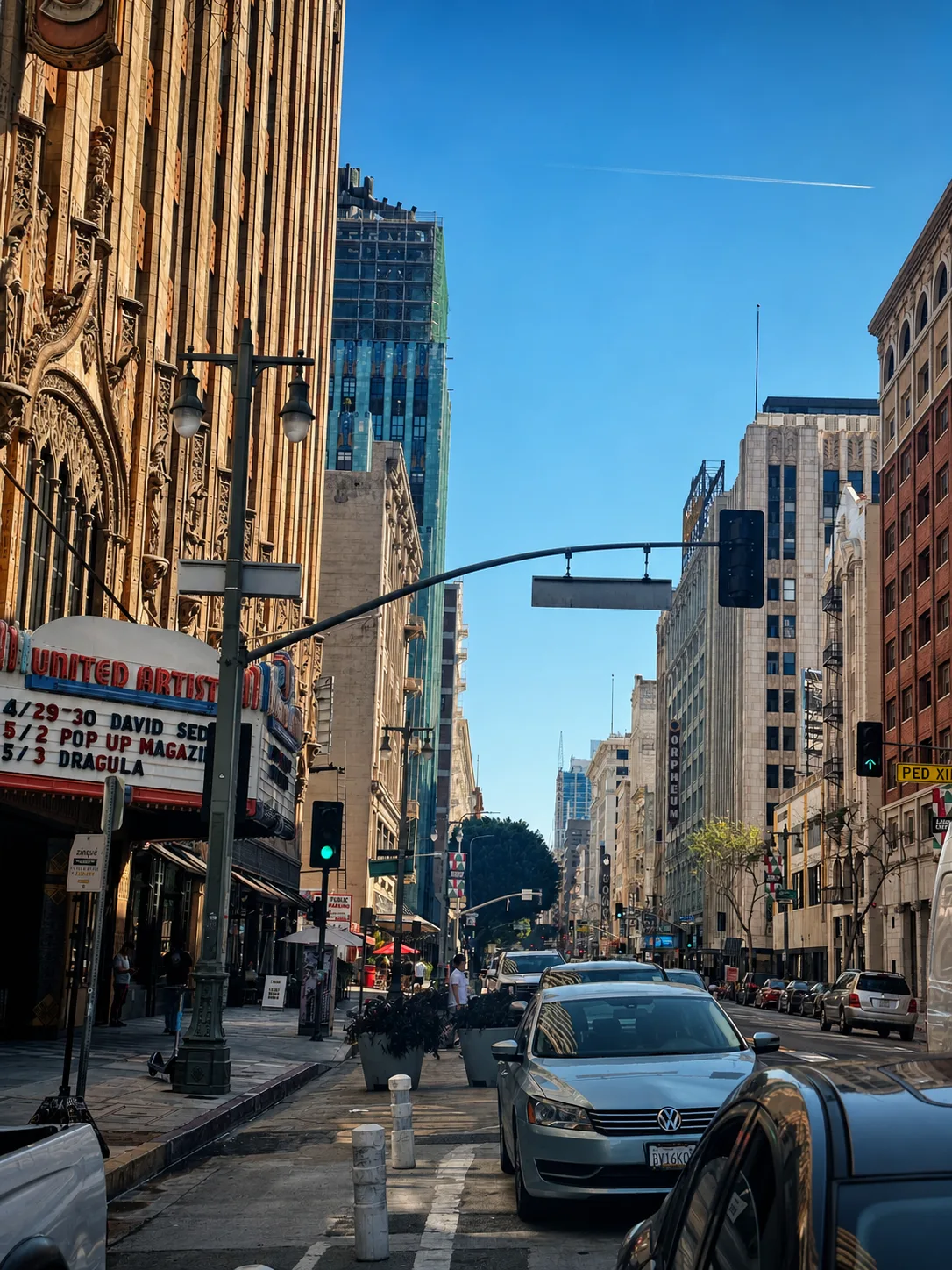 A downtown street scene with United Artists in the foreground.