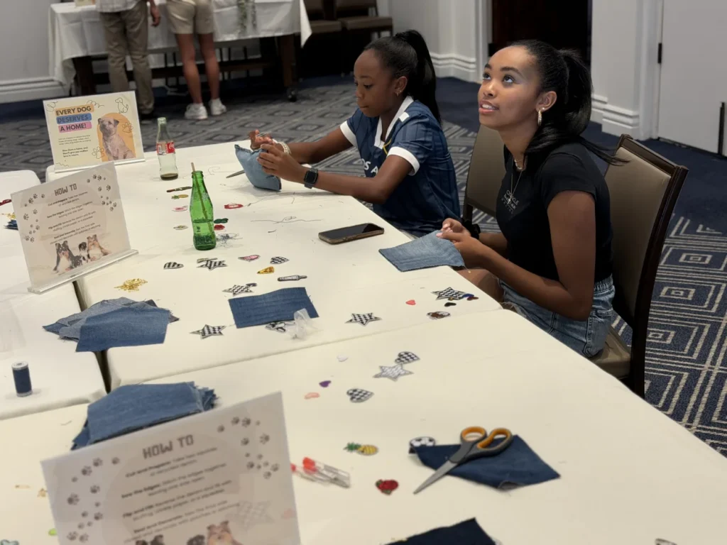 Kids participating in recycled dog toy maing