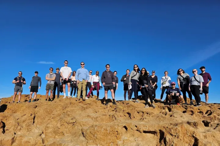 Group on top of a cliff during a hike in San Diego