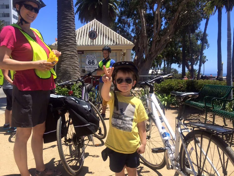 A child shows a peace sign in Santa Monica