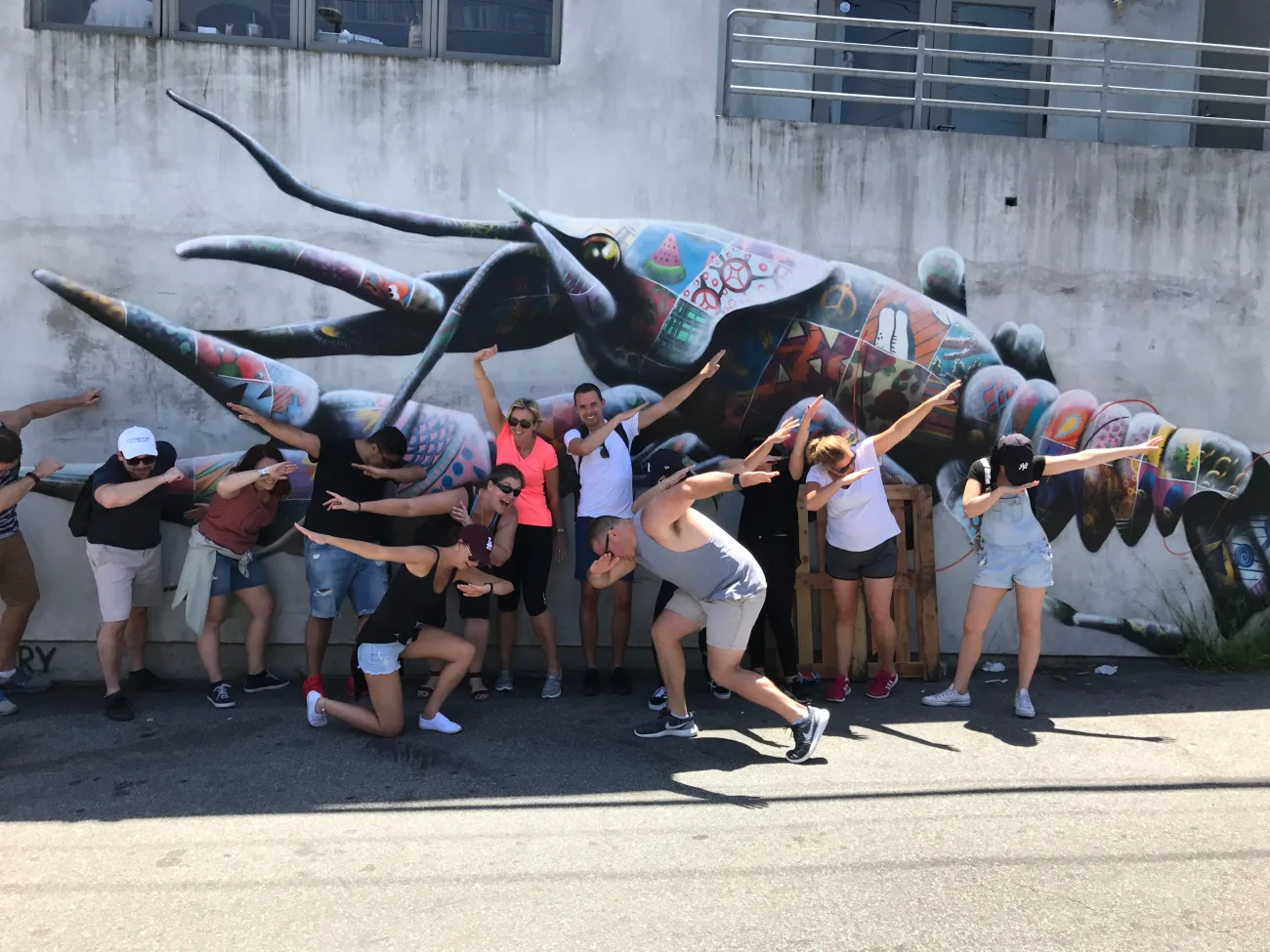 Guests posing with art work in Venice Beach