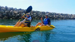 Group Kayaking near a jetty