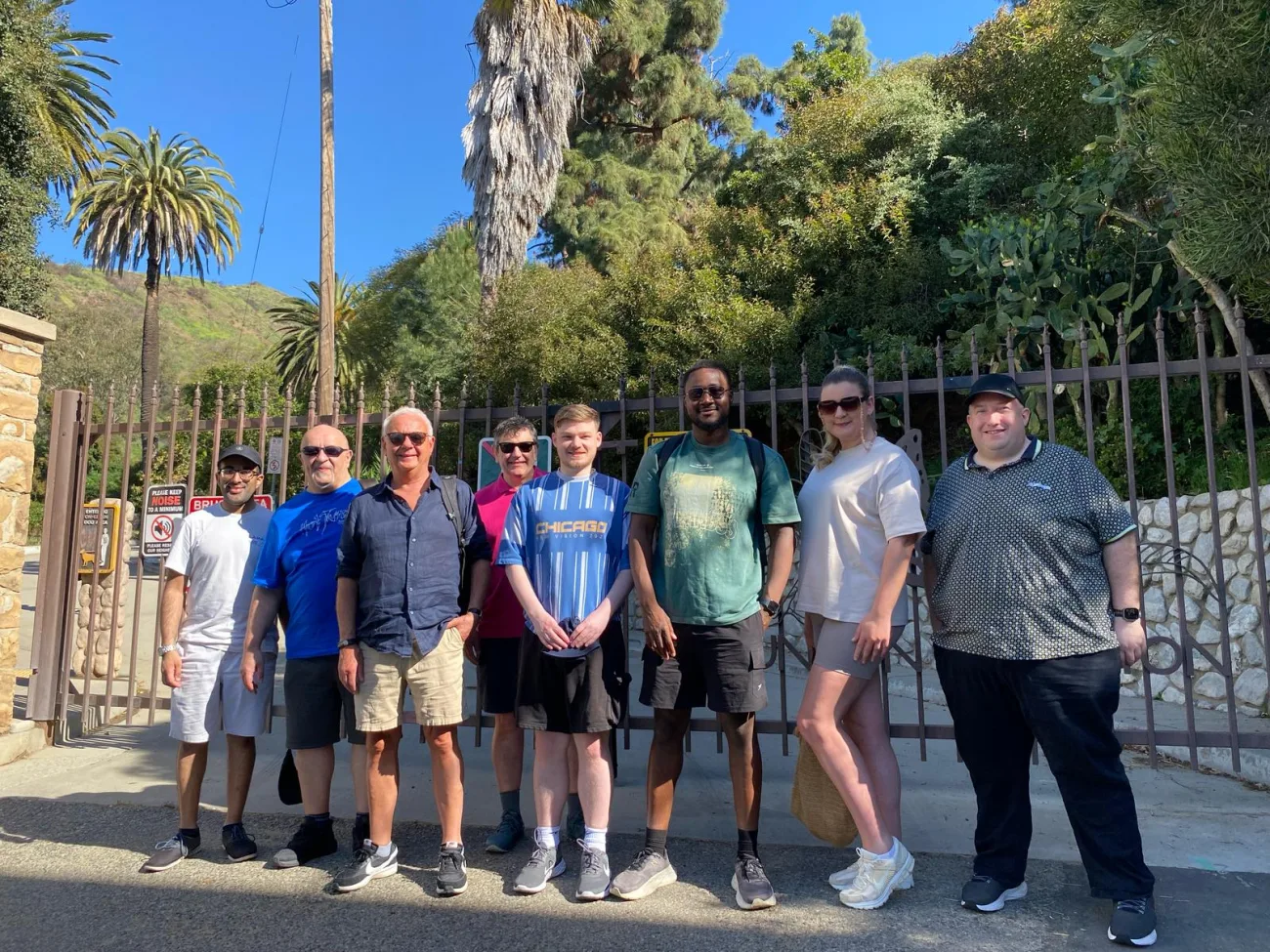 Guests pose at the gate of Runyon Canyon