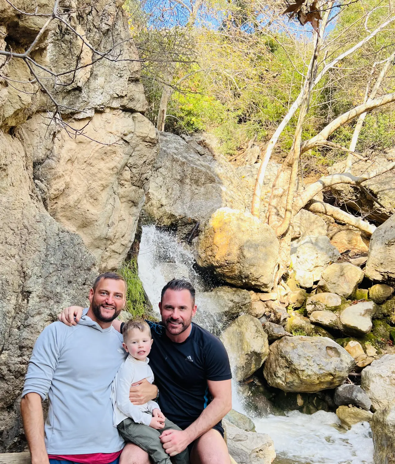 guests by a waterfall on the Solstice Canyon Hike