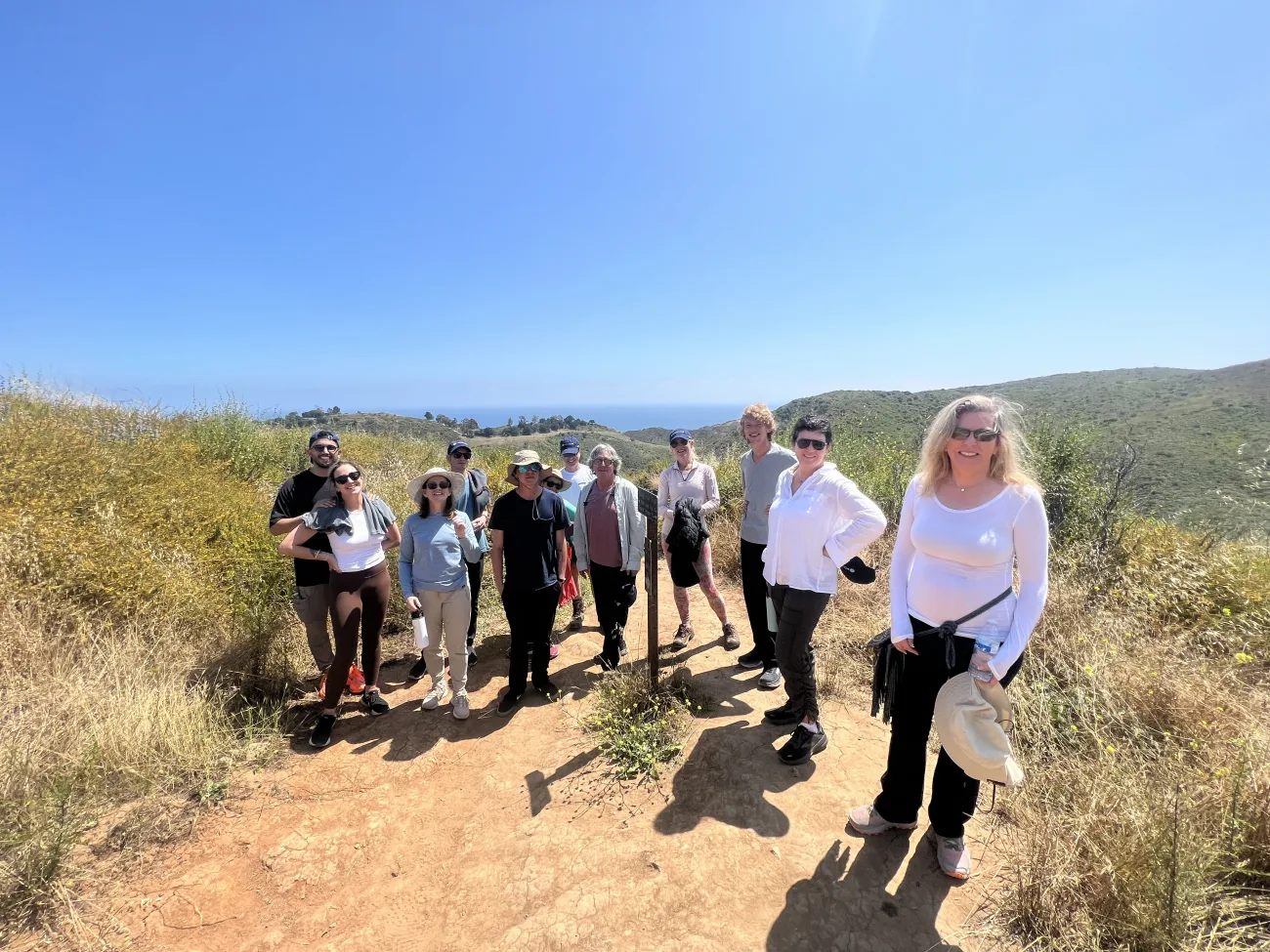 a group stands on the trail on the Solstice Canyon Hike