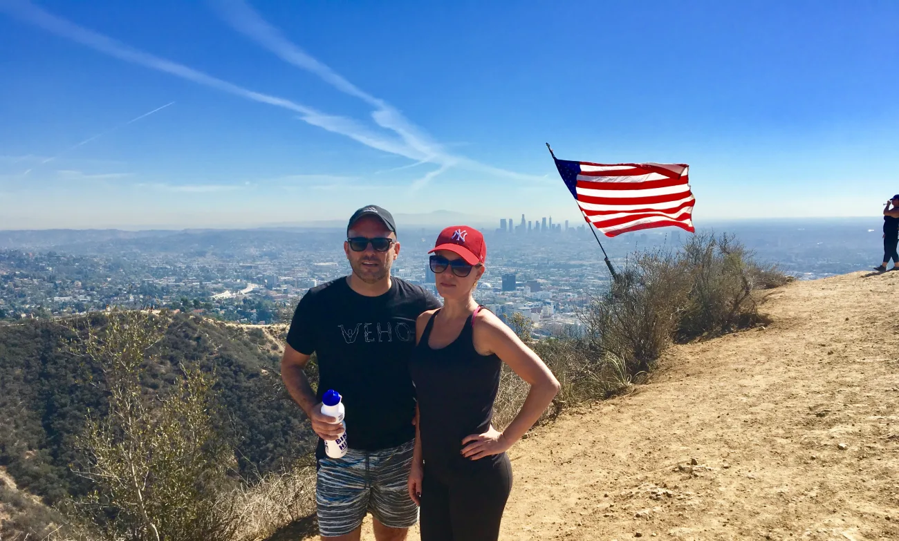 Guests pose with an American Flag at Runyon Canyon