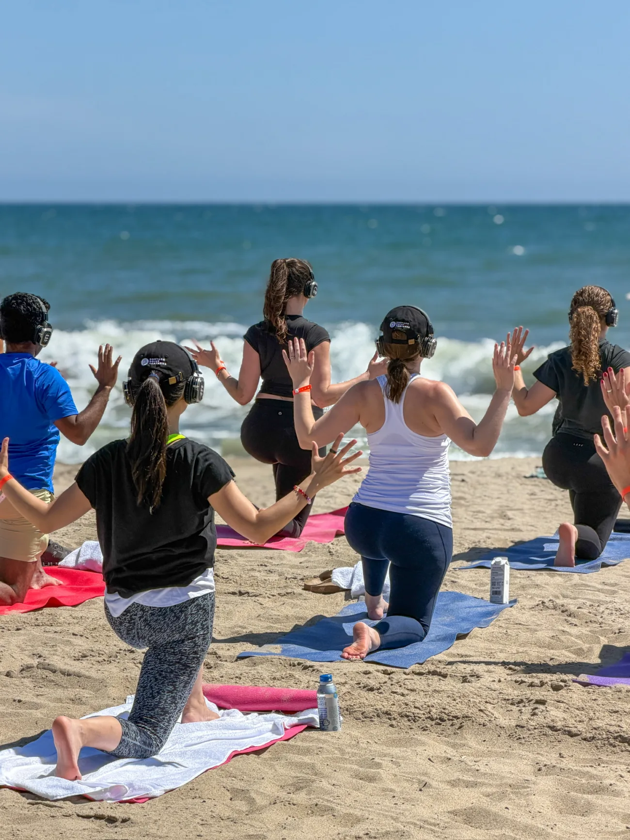 Clients doing Yoga on the Beach