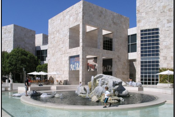 a group of people sitting in front of a building