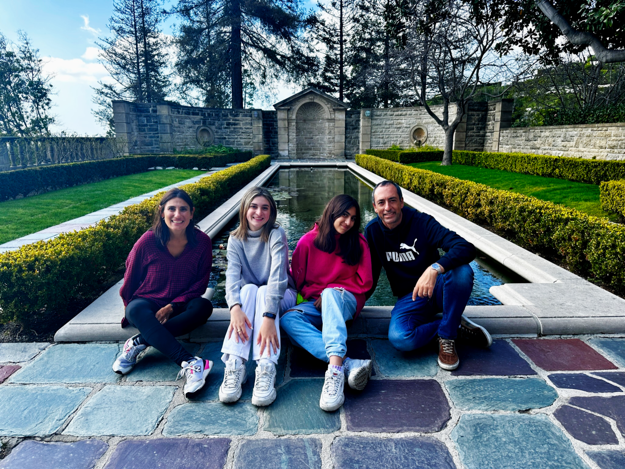 A family enjoying their time at Greystone Mansion on Bikes and Hikes LA LA in a Day Bike Tour