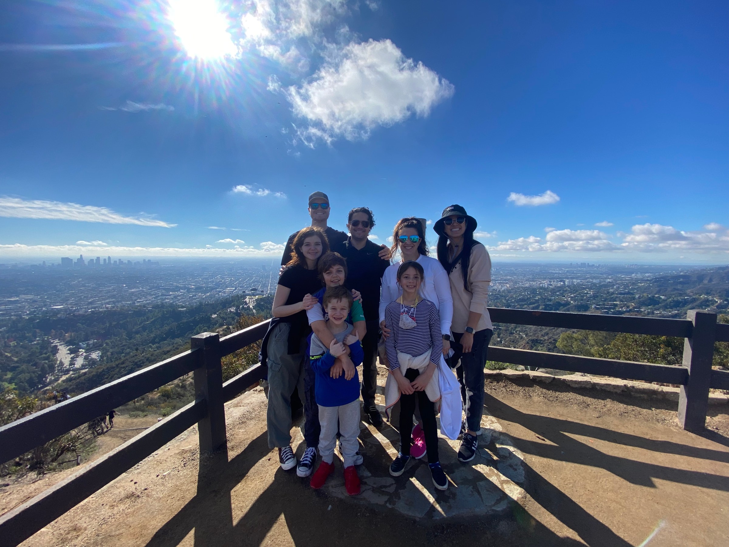 a group of people standing around a track