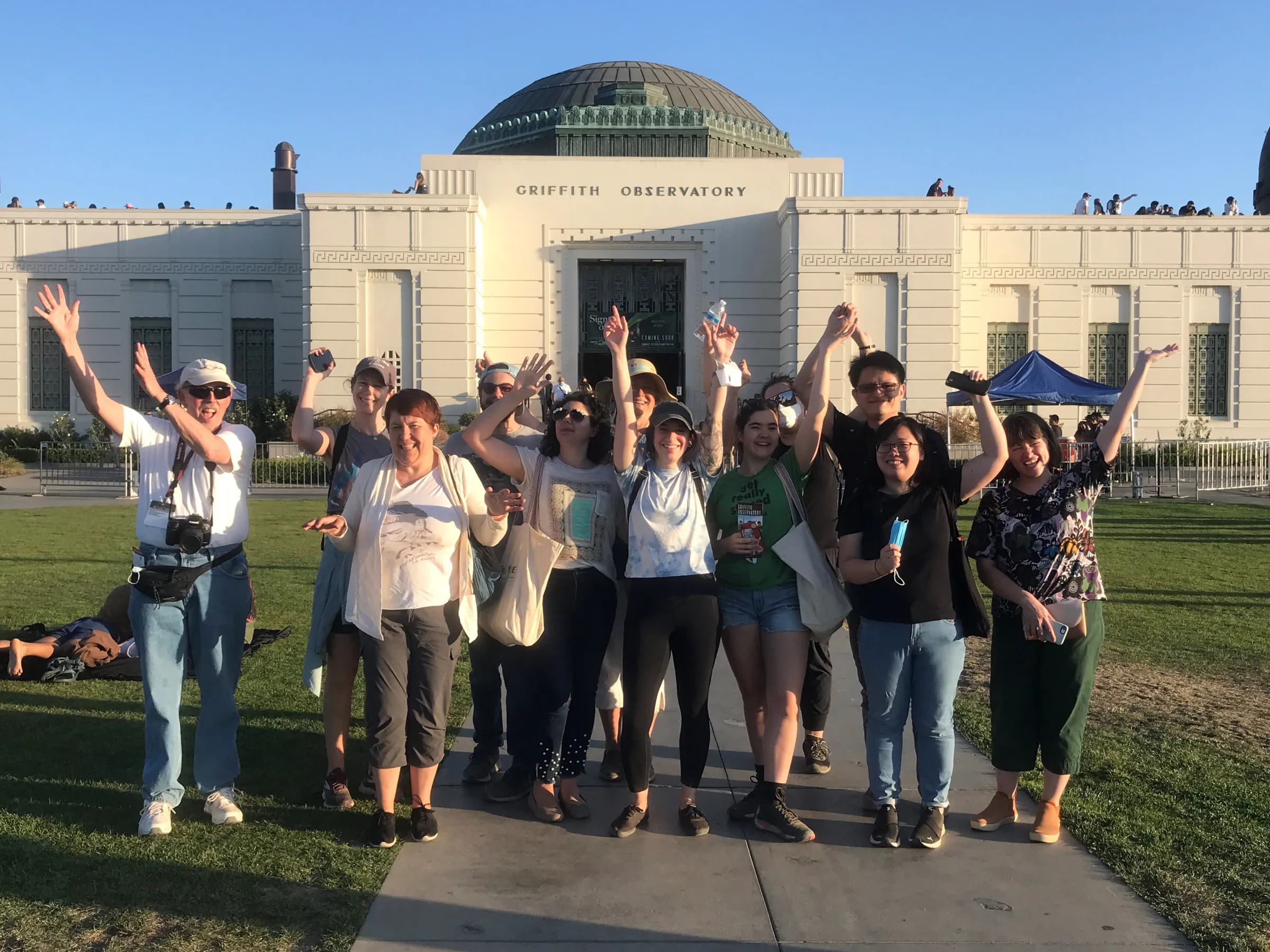 a group of people standing in front of a building