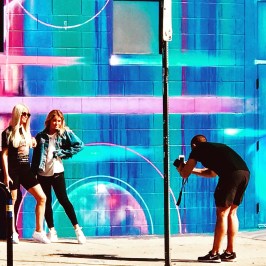 a group of people standing on a beach