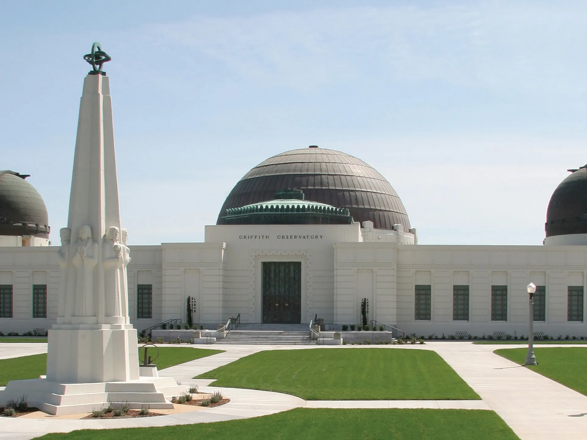 a large lawn in front of the Griffith Observatory in Los Angeles