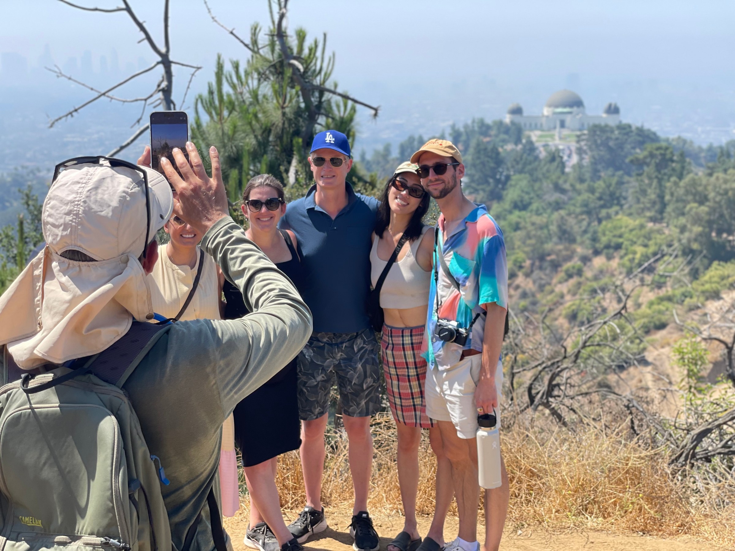 a group of people standing next to a person