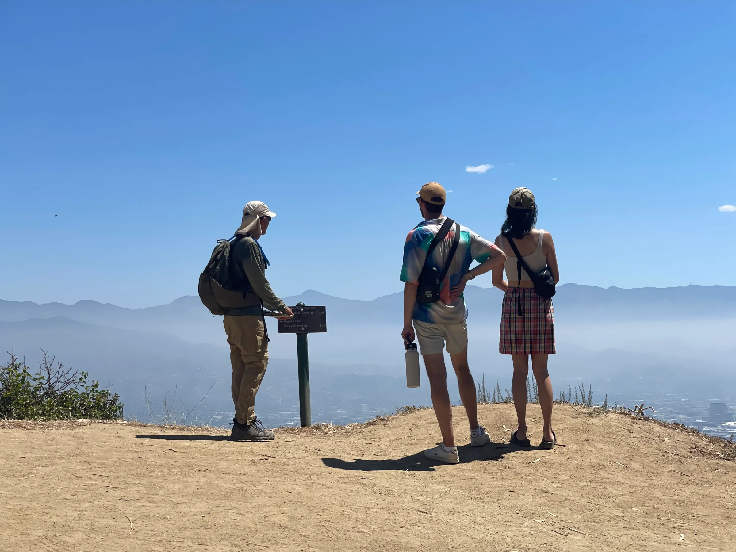 a group of people standing on a beach