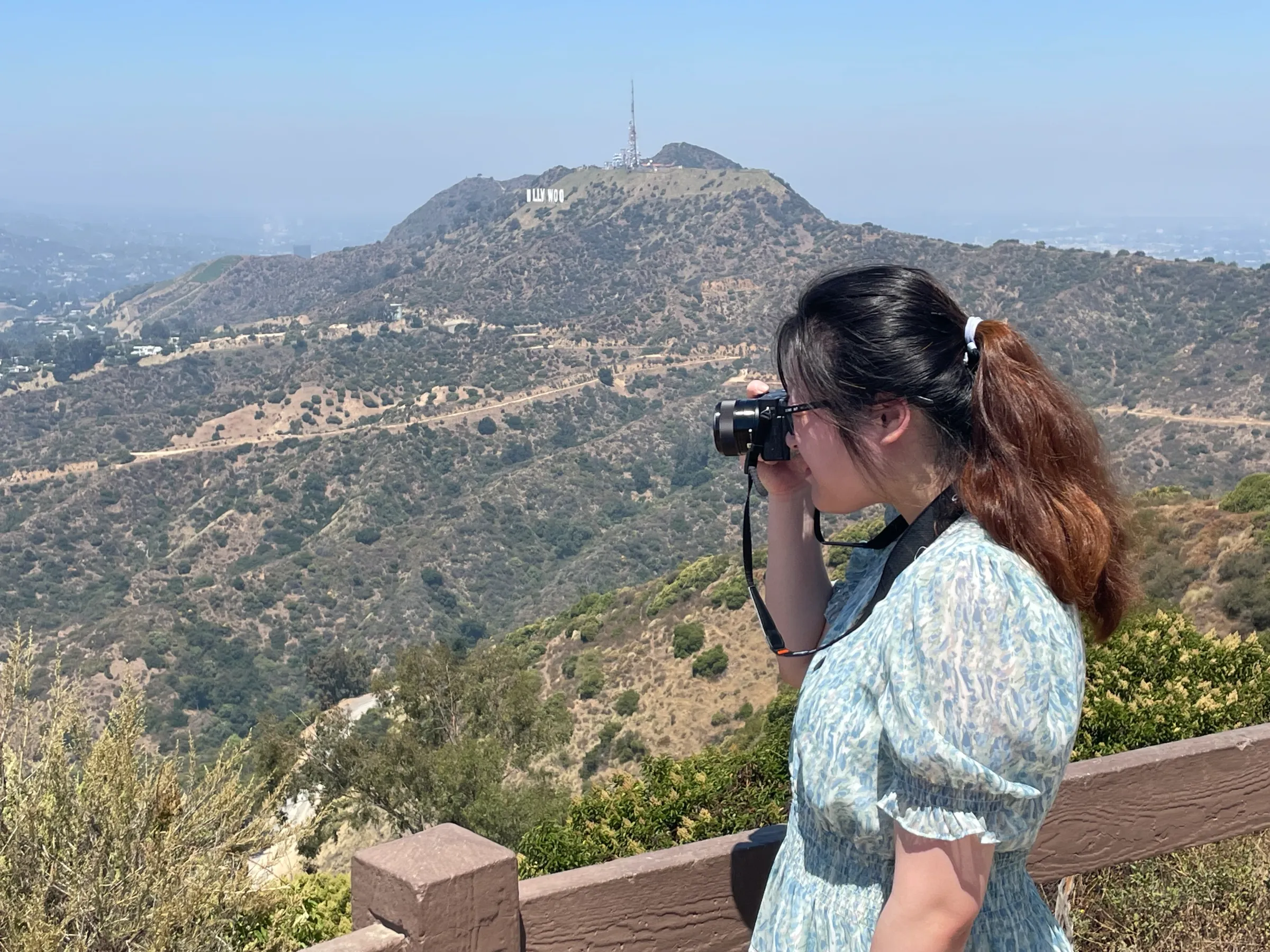 a man standing in front of a mountain