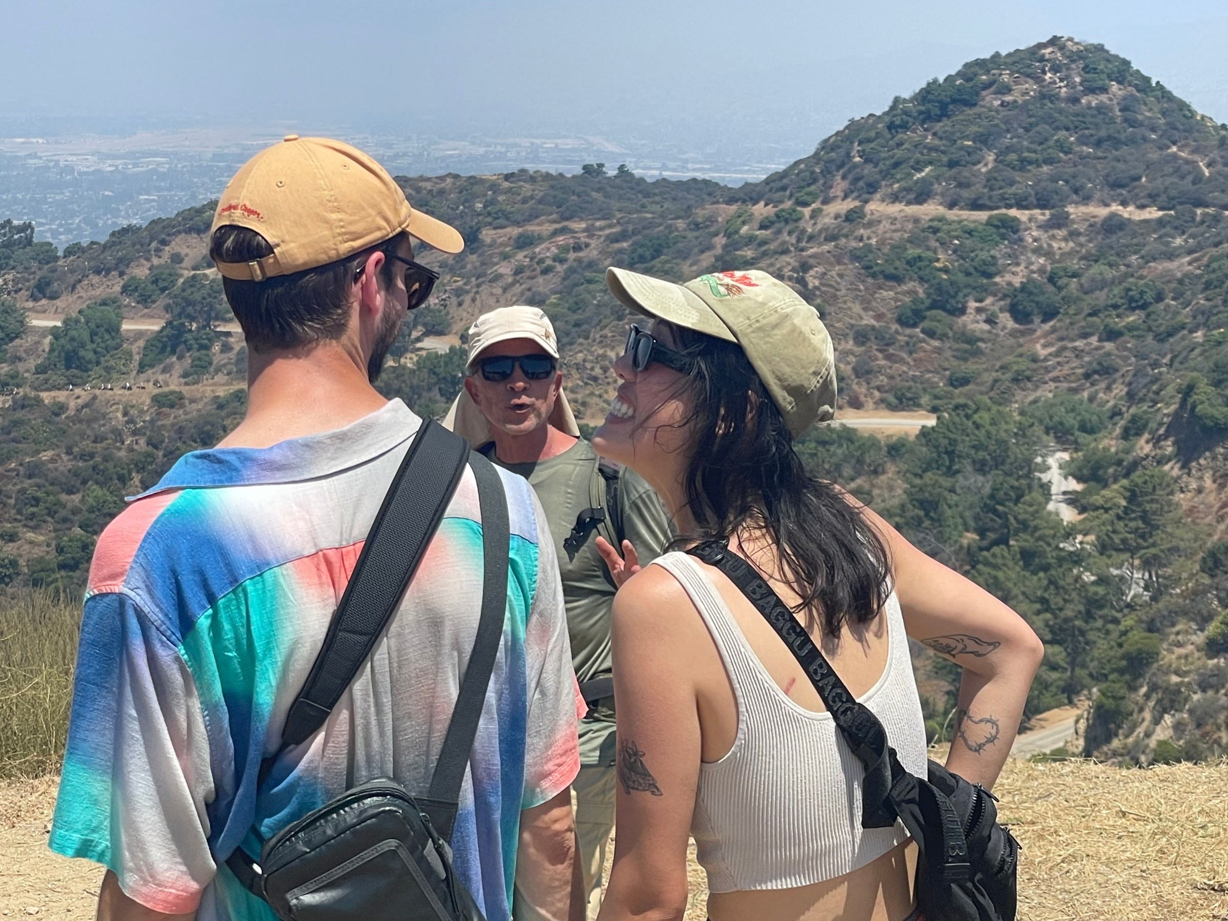 a group of people standing on top of a mountain