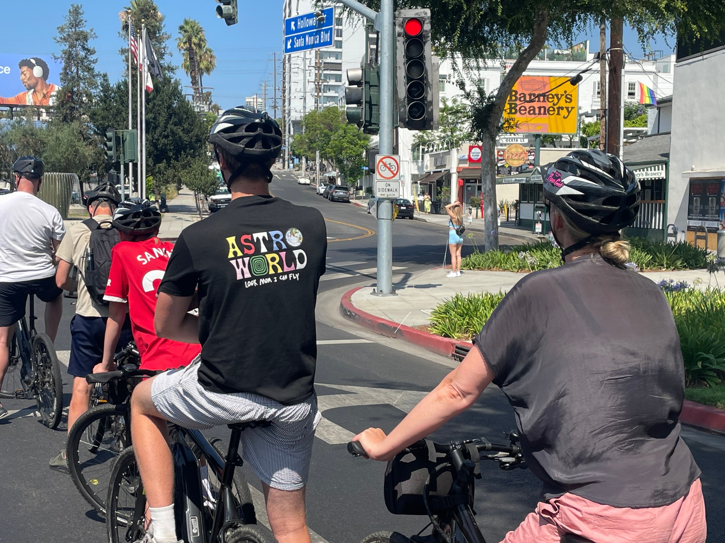 Guests riding down Santa Monica Blvd on Our Los Angeles in a Day Bike Tour