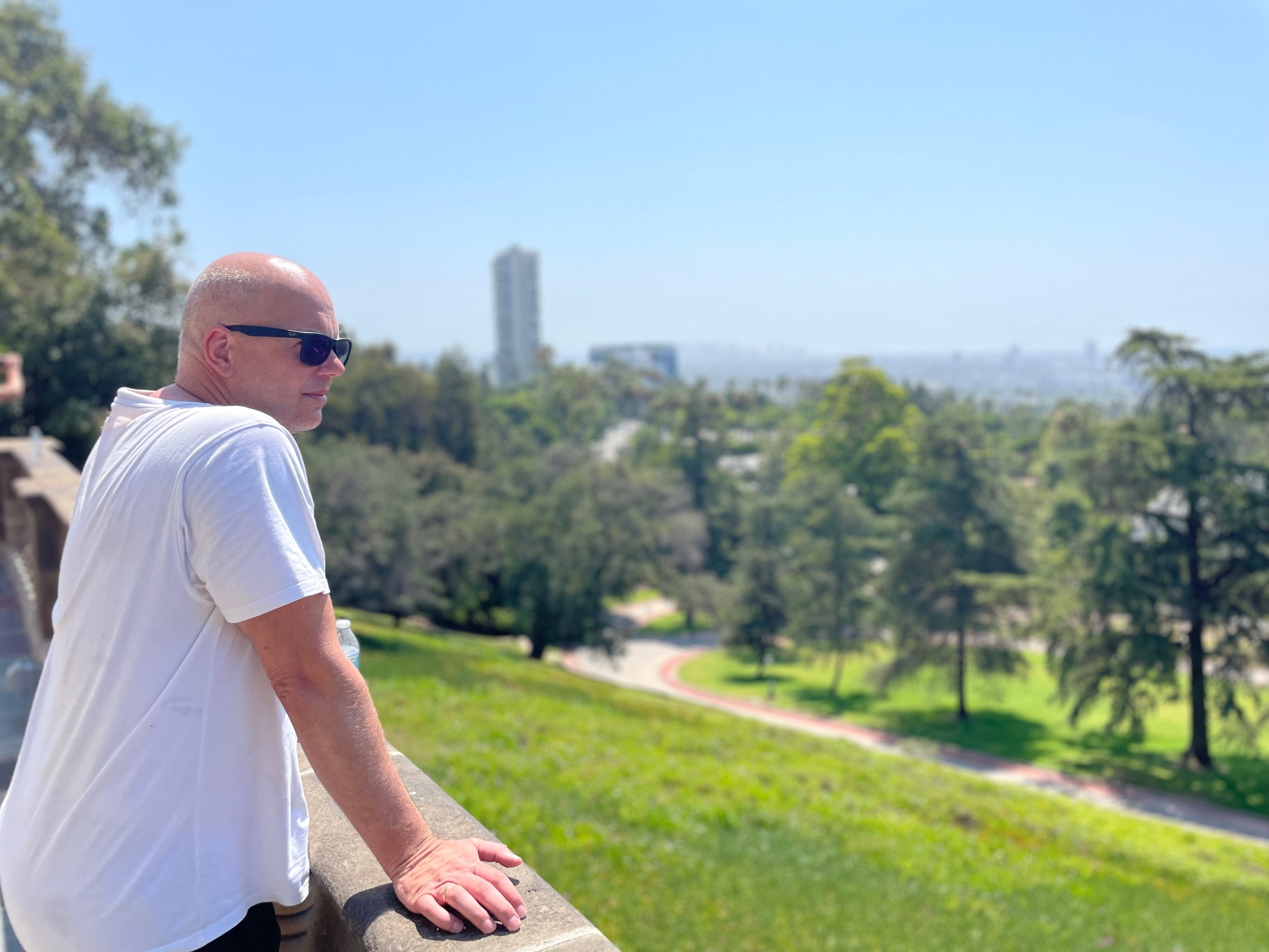 A guest on our bike tour takes in the view at Greystone Mansion