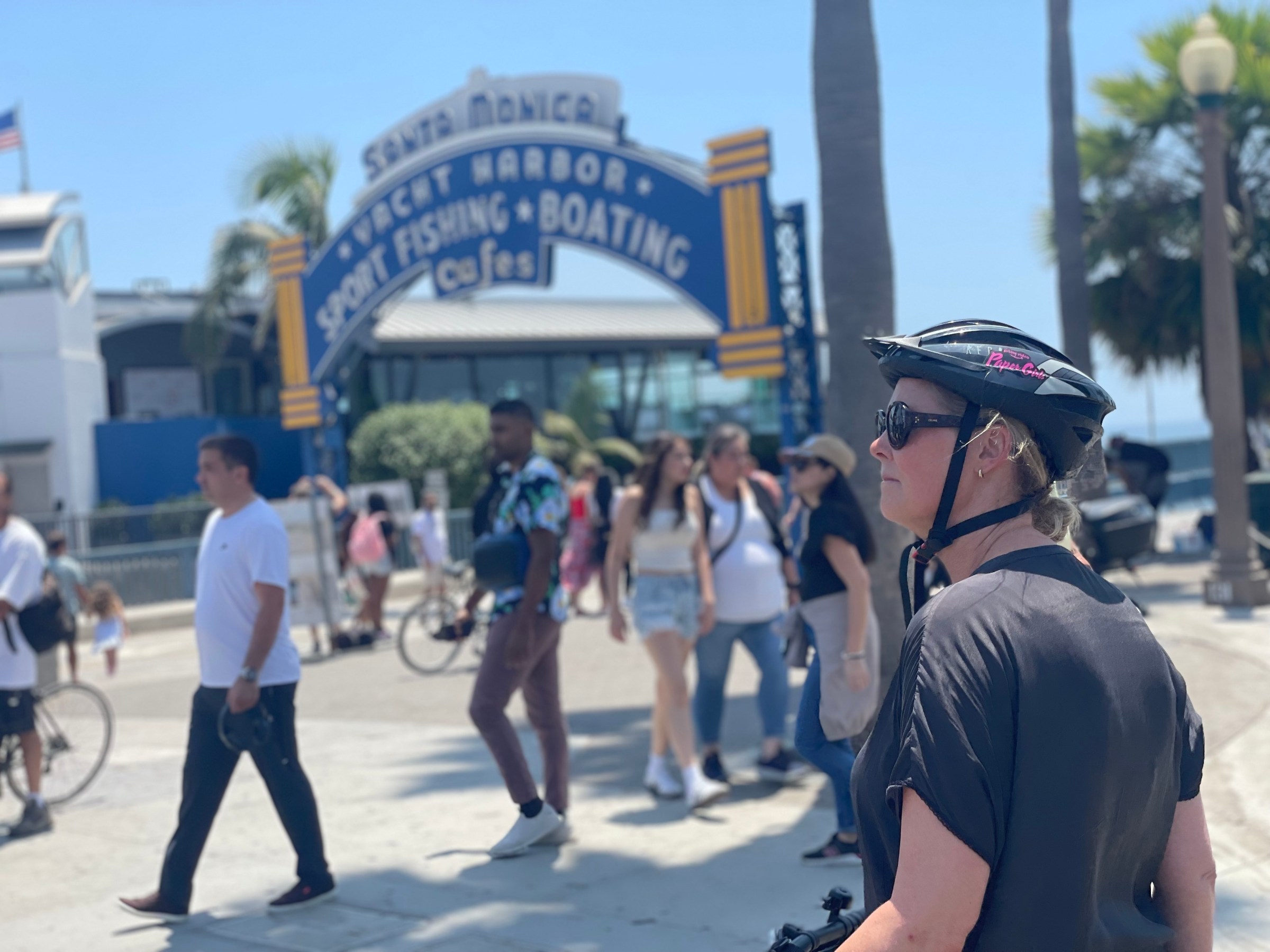 Bikes and Hikes LA LA in a Day Tour Guest in front of the Santa Monica Pier