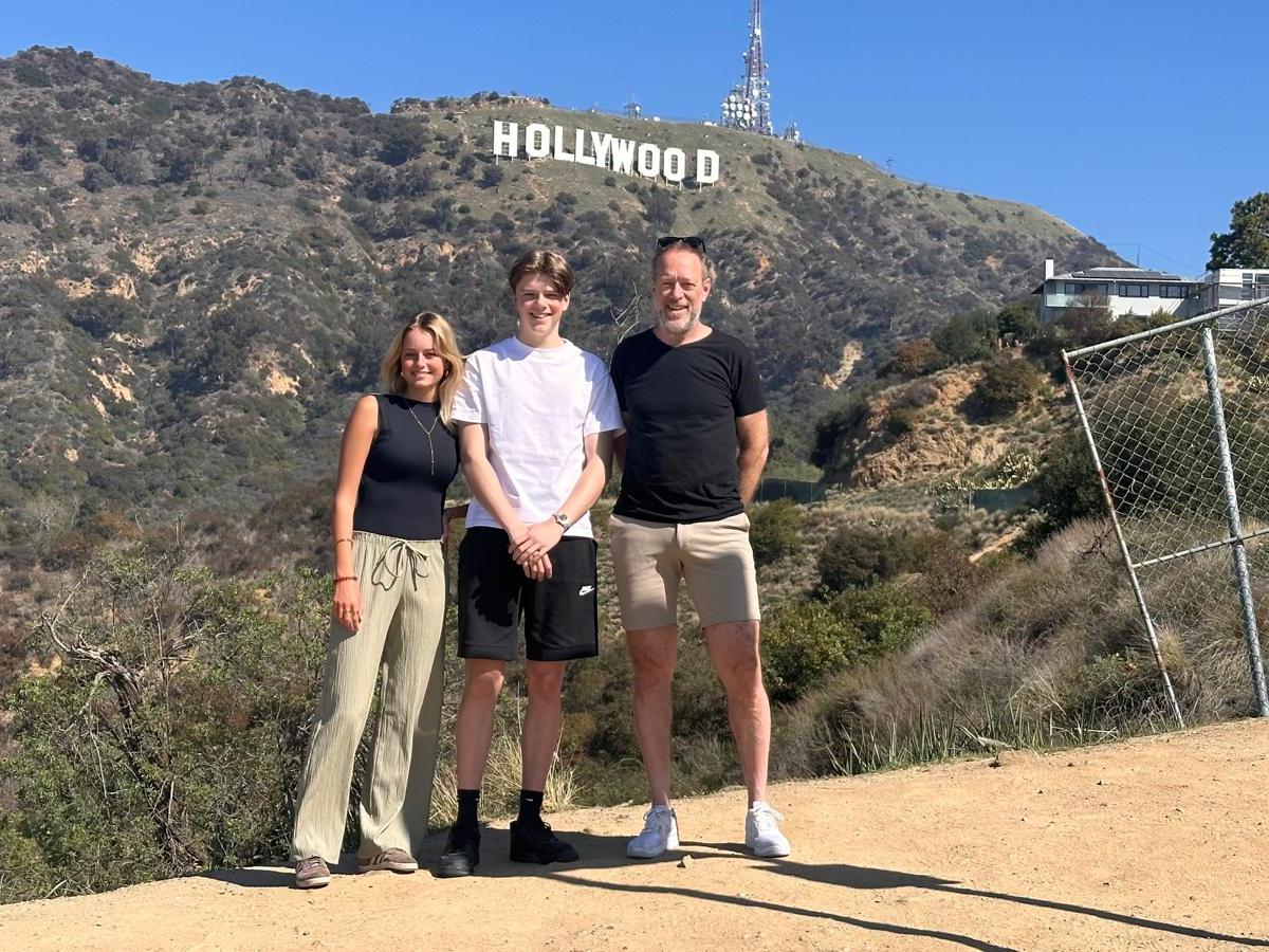 a man standing in front of a mountain