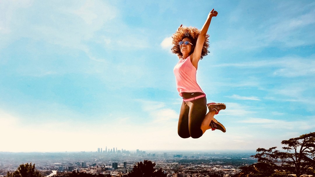 woman jumping in the air on a hollywood hike