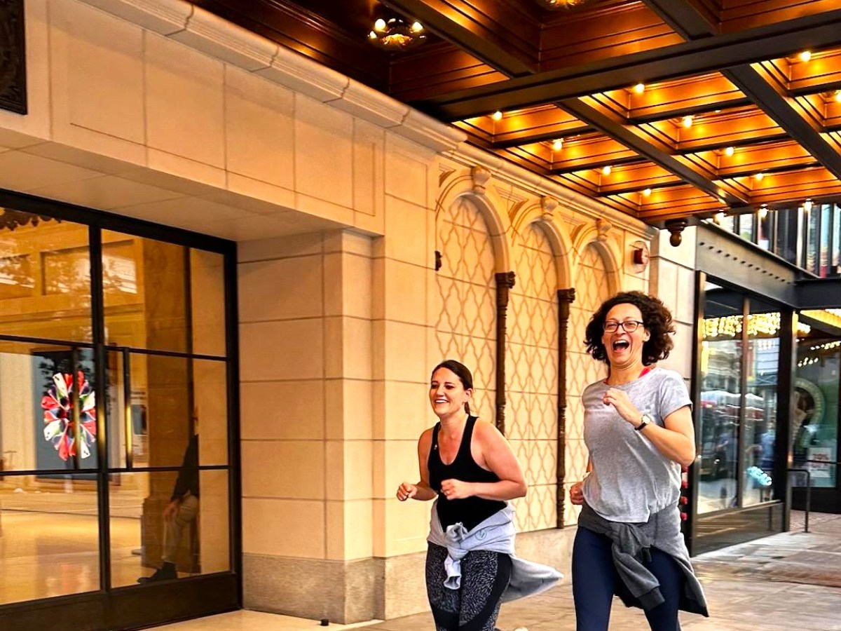 a man standing in front of a building